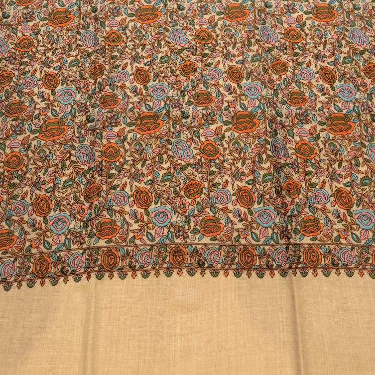Floral patterned rug on a wooden floor