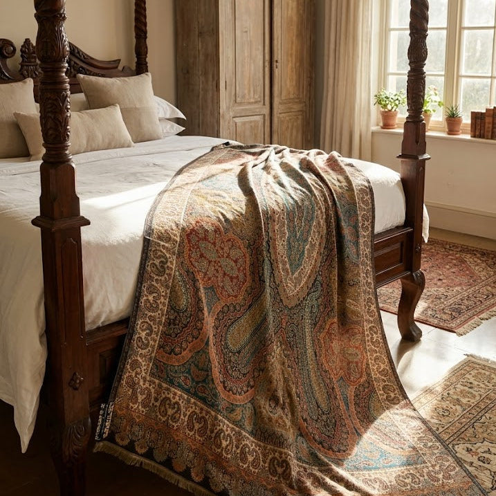 Bedroom with wooden four-poster bed and patterned blanket