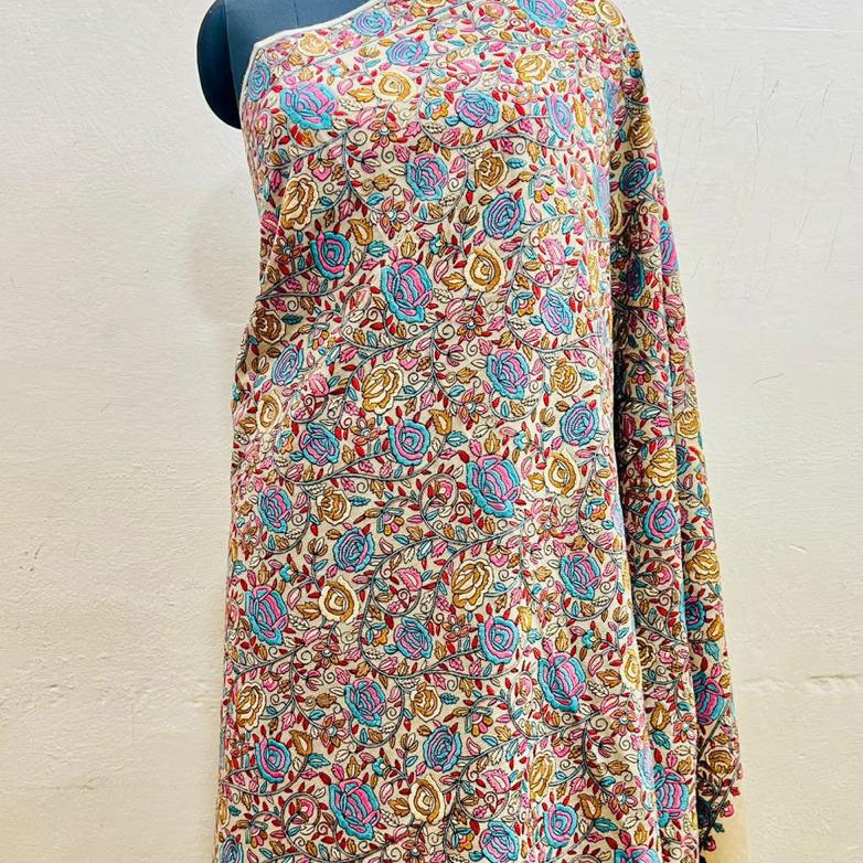 Colorful floral-patterned dress on a mannequin against a white background