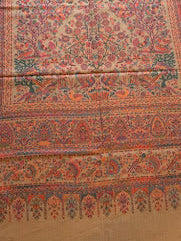 Decorative stole with intricate patterns on a wooden floor