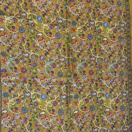 Decorative stole with intricate paisley and floral patterns on a yellow background