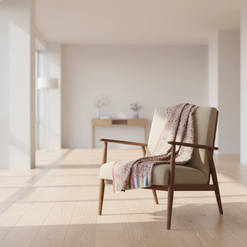 Decorative rug with a floral pattern on a light wooden floor.