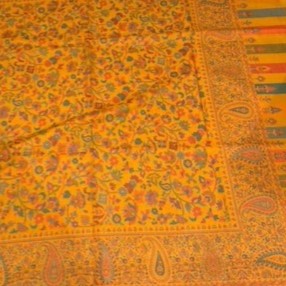 Orange fabric with intricate patterns and designs
