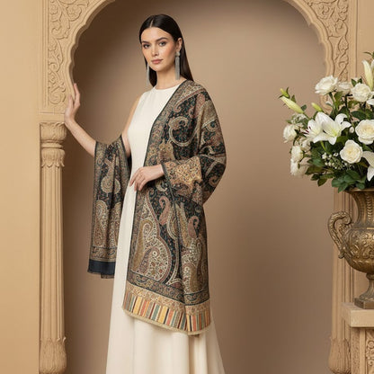 Woman wearing a patterned jacket over a white outfit in an ornate setting with flowers.