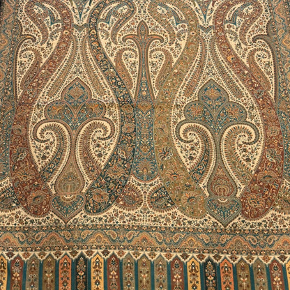 Decorative rug with intricate patterns on a light wooden floor.