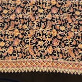 Floral patterned fabric on a wooden floor