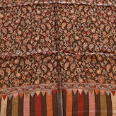 Long, patterned fabric on a wooden floor