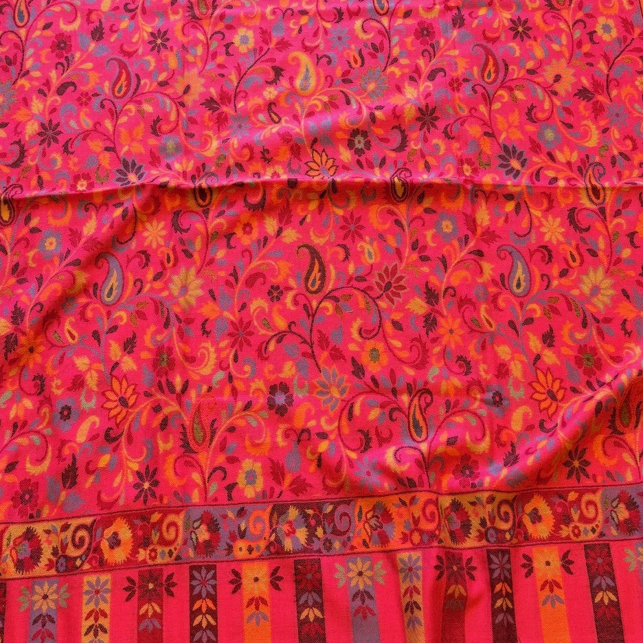 Red patterned fabric on a wooden floor