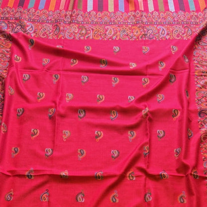 Red patterned fabric on a wooden floor