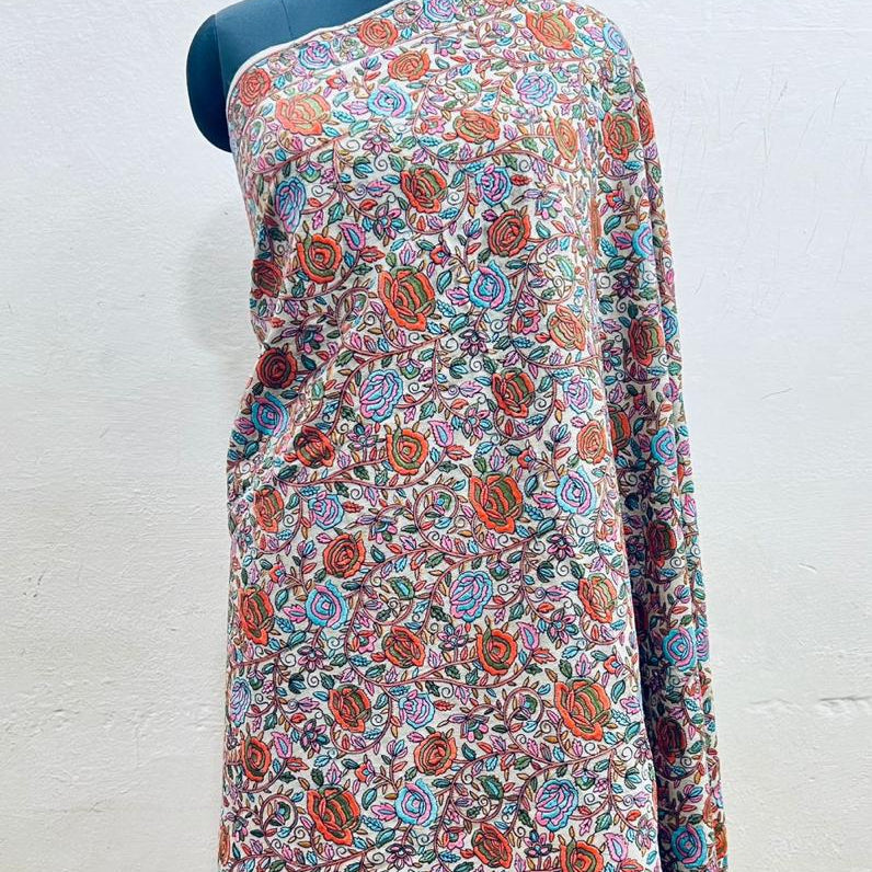 Floral patterned fabric draped over a mannequin on a white background