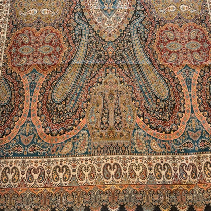 Decorative shawl with intricate patterns on a plain background