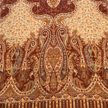 Decorative rug with intricate patterns on a light wooden floor.