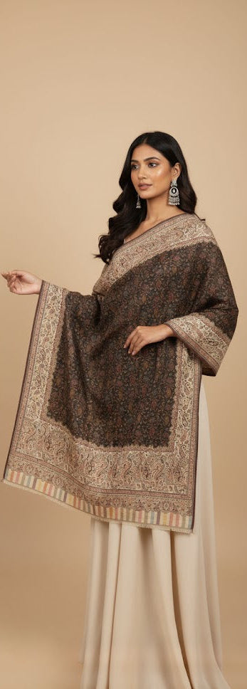 Woman wearing a traditional outfit with a patterned shawl on a beige background