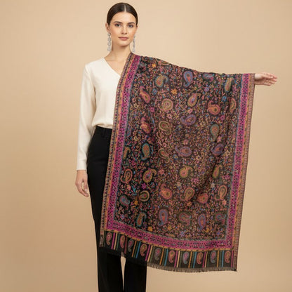 Woman holding a patterned scarf against a beige background