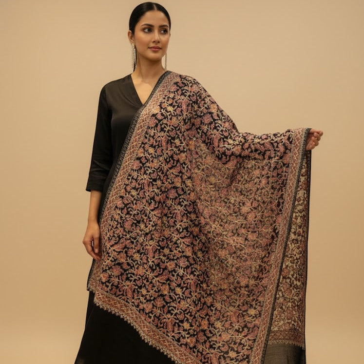 Woman holding a patterned scarf against a beige background