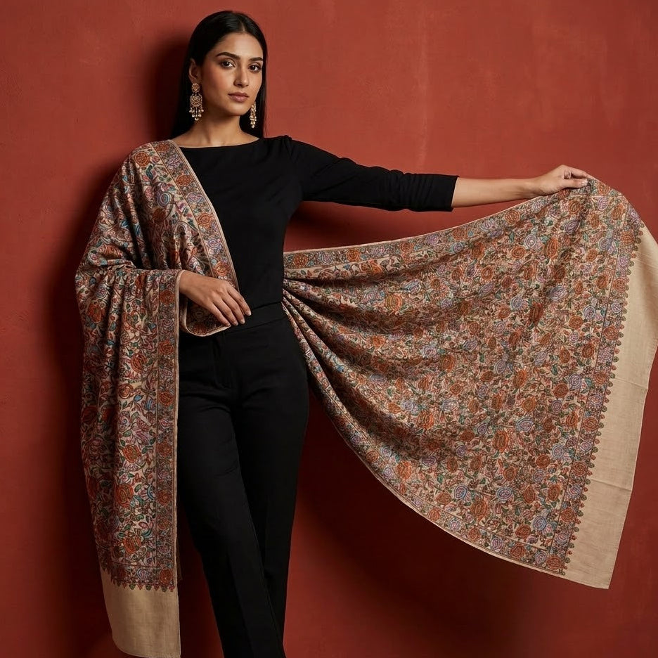 Woman holding a floral patterned scarf against a red background