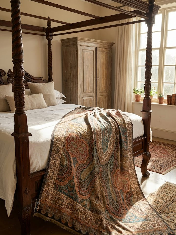 Bedroom with wooden four-poster bed and patterned blanket