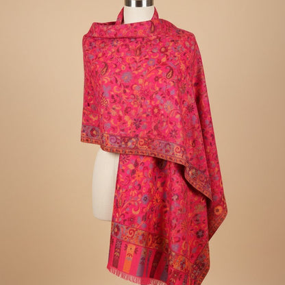 Red patterned scarf on a mannequin against a beige background