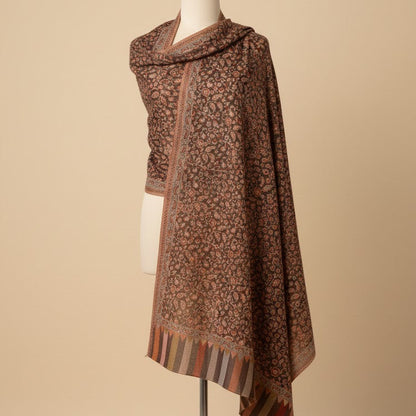 Patterned scarf on a mannequin against a beige background