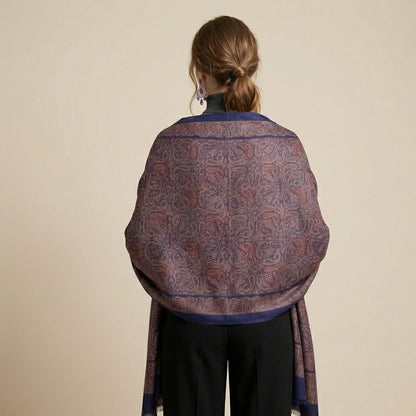 Woman wearing a patterned scarf on a beige background