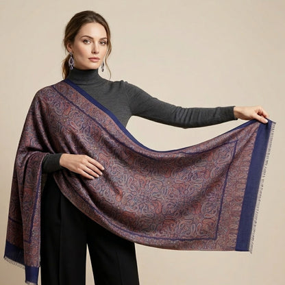 Woman holding a patterned scarf against a beige background