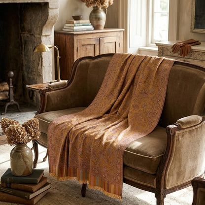 Silk Wool Kani Jamawar shawl in yellow draped on a  statement sofa