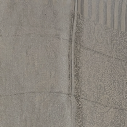 Close-up of a textured tile with a decorative border