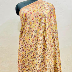 Floral patterned fabric draped over a mannequin on a white background