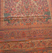 Decorative stole with intricate patterns on a wooden floor