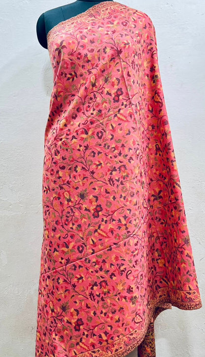 Mannequin wearing a pink floral shawl against a white background