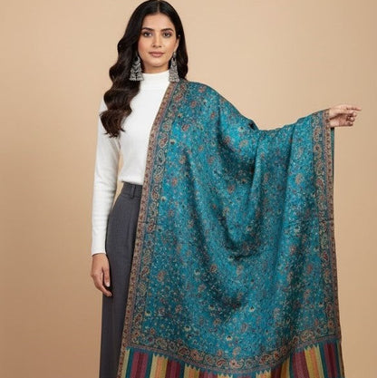 Woman wearing a blue patterned scarf with a beige background