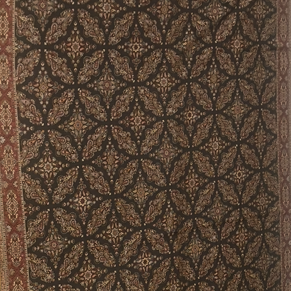Patterned shawl with geometric design in brown and beige tones