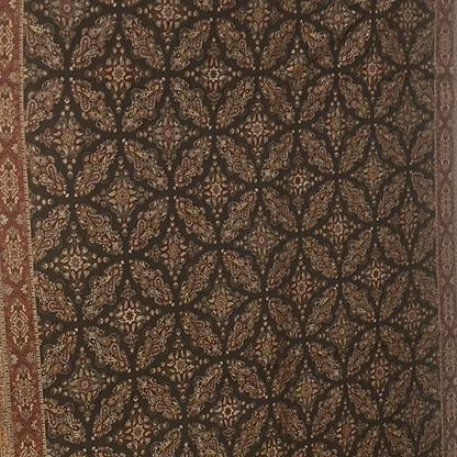 Patterned shawl with geometric design in brown and beige tones