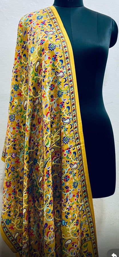 Colorful Stole with a yellow border on a mannequin against a white background