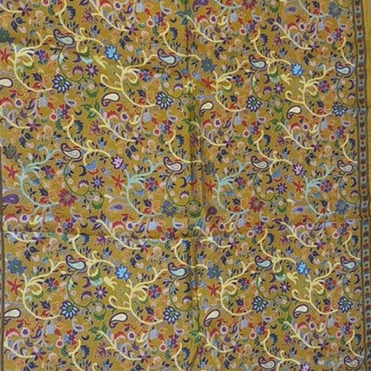 Decorative stole with intricate paisley and floral patterns on a yellow background