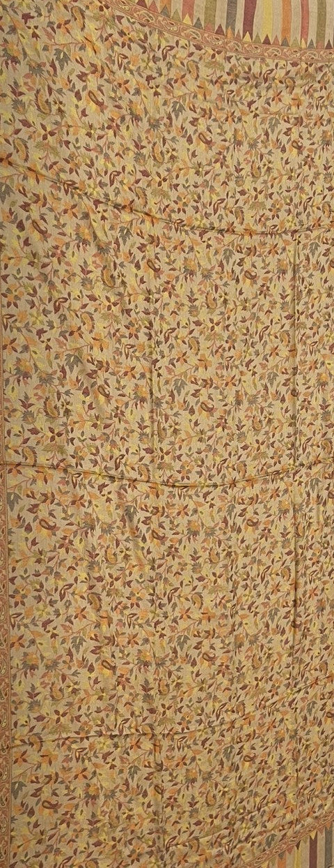 Textured fabric with a pattern of small, multicolored dots on a beige background