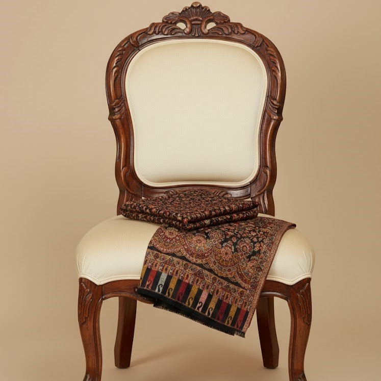 Black Multifloral Kani Shawl draped on a chair