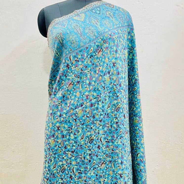 Kani Shawl in sky blue draped on a female mannequin