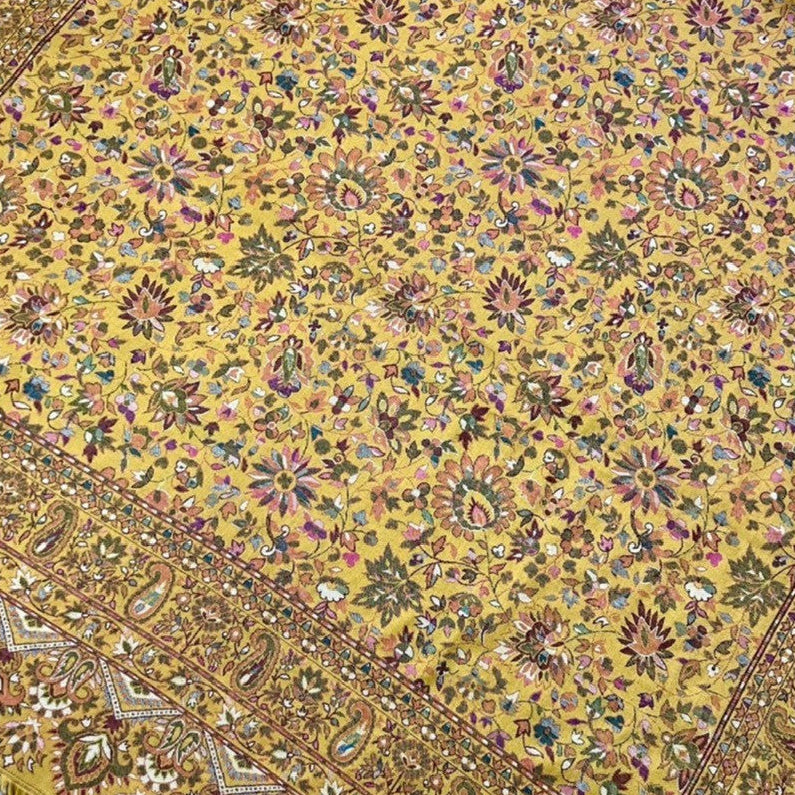 Pure wool kani shawl with sunflower design draped on the floor