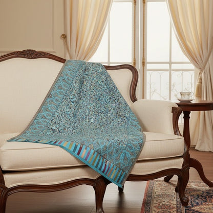 Kani Shawl in sky blue draped on a female model