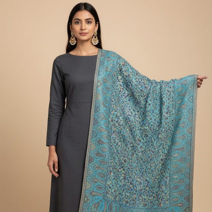 Kani Shawl in sky blue draped on a female model