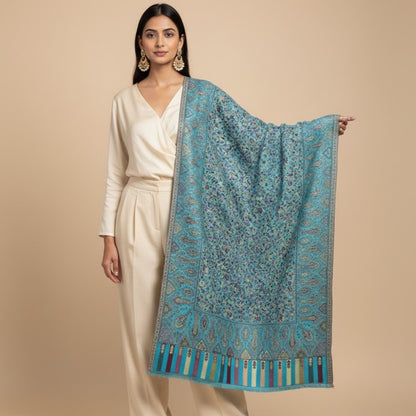 Kani Shawl in sky blue draped on a female model