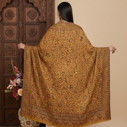 Pure wool kani shawl with sunflower design draped on a female model