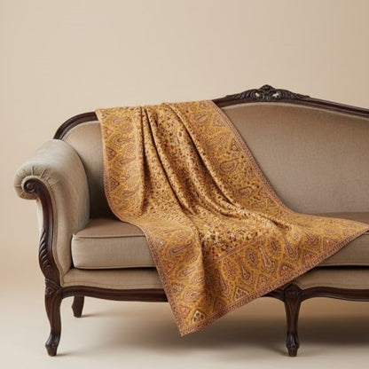 Beautiful yellow kani shawl on a sofa
