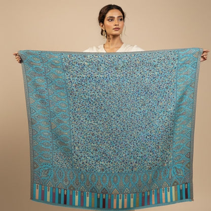 Kani Shawl in sky blue draped on a female model