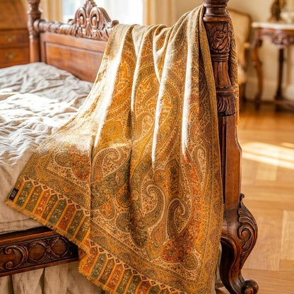 Patterned blanket draped over a wooden bed in a bedroom setting