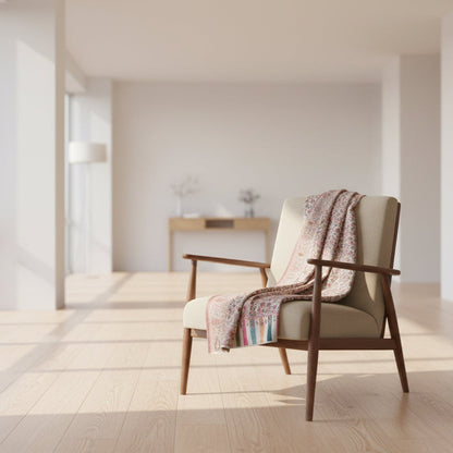 Decorative rug with a floral pattern on a light wooden floor.