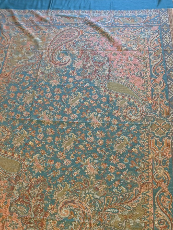Decorative deep teal blue patterned jamawar kani pure wool shawl with intricate patterns on a wooden floor.