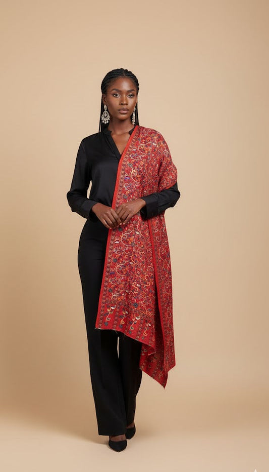 Woman wearing a red paisley patterned kalamkari-inspired stole in faux pashmina 